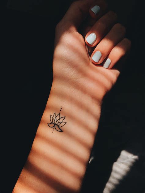 Small Lotus Flower Tattoo Finger