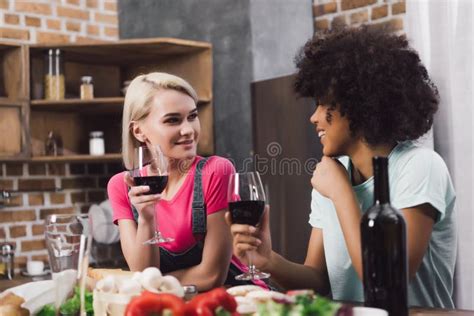 Multiethnic Girls Talking With Wine Stock Photo Image Of Kitchen