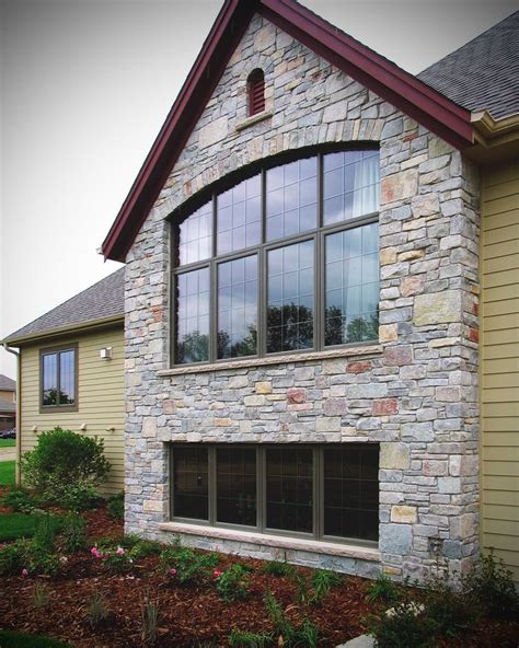 Landscape natural stone options for patios and walls including flagstone and steppers irregular (aqua blue, carnelian granite, charcoal granite, rockville granite, chilton limestone. Refined rustic ranch house - Cabin Creek River Rock veneer ...