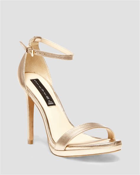 Add an inch of glamour and confidence to every step with our high heels and dressy heels. Steven By Steve Madden Sandals - Rykie Ankle Strap High Heel in Gold | Lyst