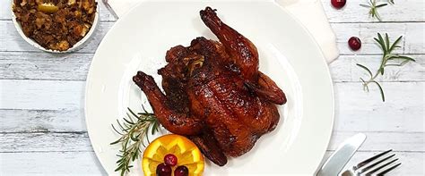 Cornish hens are becoming popular again, and especially for dinner parties. #ad Orange Glazed Smoked Cornish Game Hens Recipe for Christmas Dinner