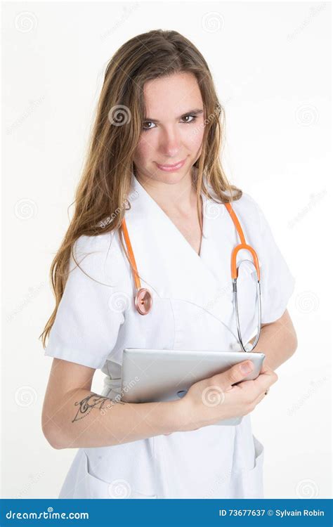 Two Cheerful Doctors Using A Digital Tablet Isolated On White Stock