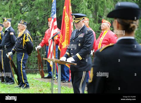 Major Gen. Patrick J. Reinert, center, commanding general of the 88th