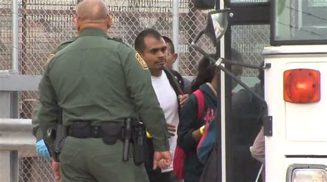 Central American Migrants Taken To Be Processed Following Night At