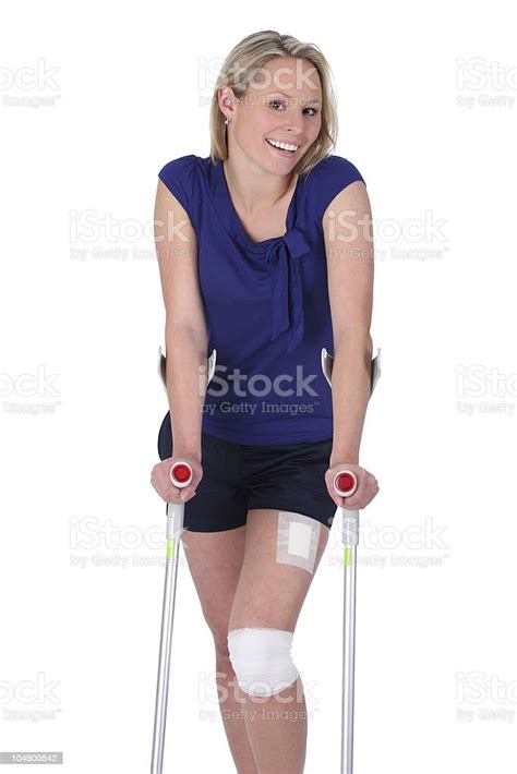 Woman With Bandage And Crutch On White Background Stock Photo