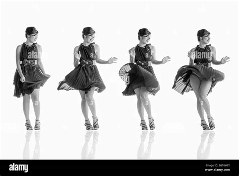 Multiple Image Of Young Woman Dancing Against White Background Stock