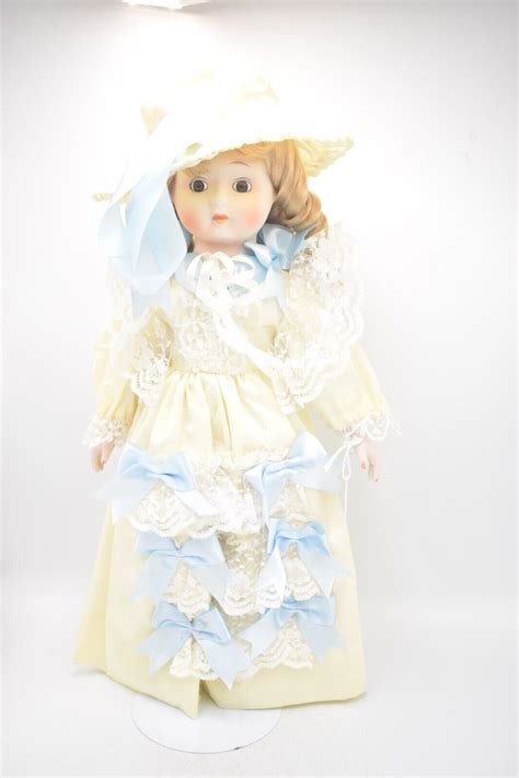 Vintage Porcelain Doll Blonde Hair Brown Eyes And Victorian Silk Dress