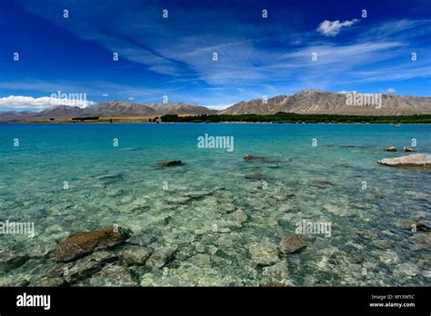 Turquoise Water Of Lake Tekapo South Island New Zealand Stock Photo
