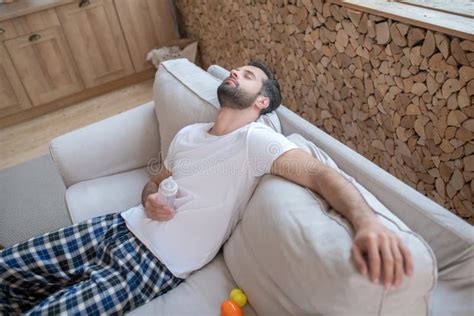 Young Happy Father Sleeping On The Sofa Feeling Exhausted Stock Image Image Of Apartment