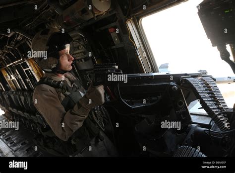 A Us Marine Door Gunner Provides Security From A Ch 53e Super Stock