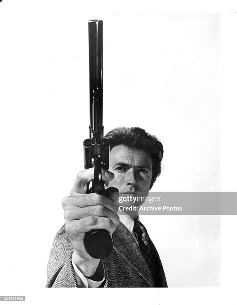 Clint Eastwood Holds A Gun In Publicity Portrait For The Film Dirty