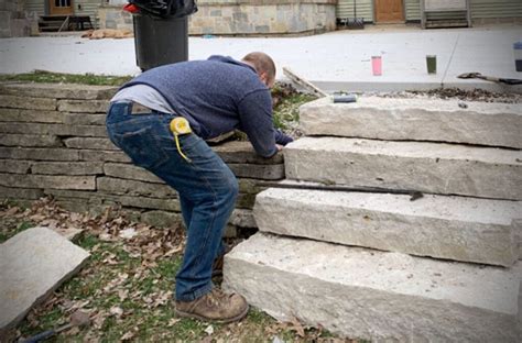 Want to build your own stone retaining wall, but unsure how to start? Backyard landscaping patio how to build a dry stacked ...