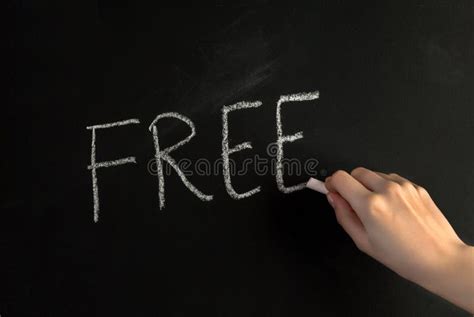Woman Hand Write Word Free On Blackboard With White Chalk Stock Image