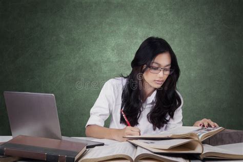 Attractive Learner Writing On The Book In Class Stock Image Image Of
