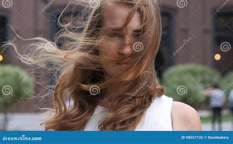 Flying Hairs In Wind Of Beautiful Young Girl Outdoor Stock Image