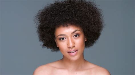 Beautiful Woman Clutching Her Afro Hairstyle Stock Video Footage