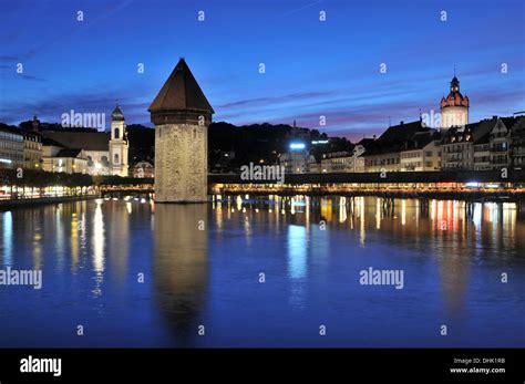 Illuminated Kapellbruecke Bridge In The Evening Luzern Switzerland