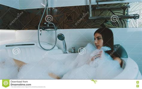 Brunette Young Girl Taking Bath Full Foam Bathroom Blow Bubbles Foam