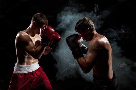 Two Professional Boxer Boxing On Black Smoky Background High Quality