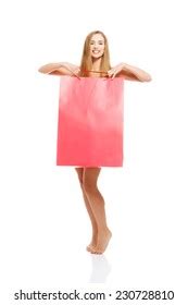 Nude Woman Covering Herself By Shopping Stock Photo