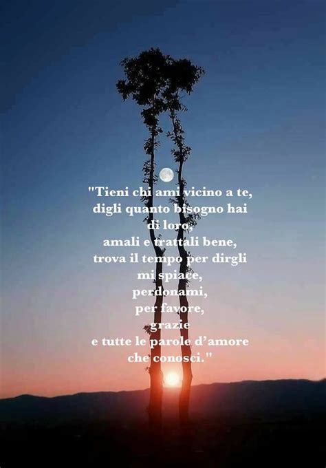 The Sun Is Setting Behind A Tree With A Poem Written In Spanish On Its