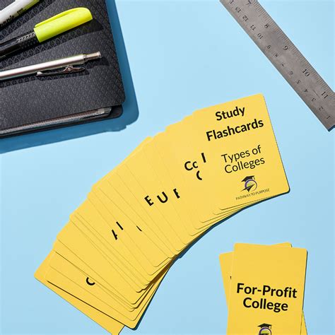 Four Yellow Business Cards Sitting On Top Of A Table Next To A Ruler