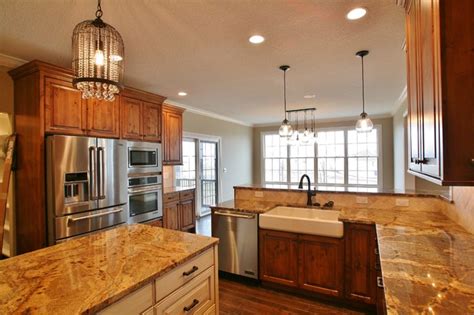 Aesthetic antique style kitchen cabinets of wooden materials finished in white. Antique White & Stained Cabinets