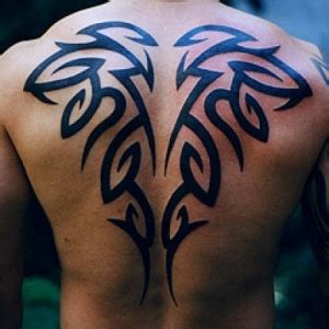 The deep and vibrant black color compliments the edges and the markings of the tattoo. 28 Awesome Tribal Back Tattoos | Only Tribal