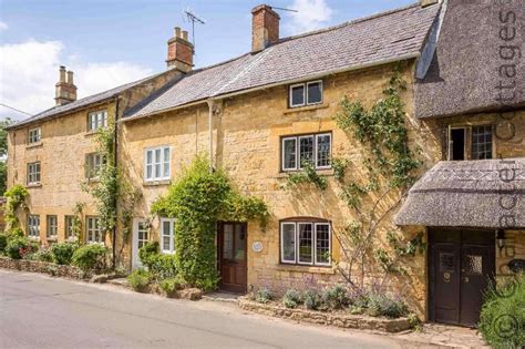 Green Cottage Sits In A Row Of Traditional Cotswold Stone Cottages