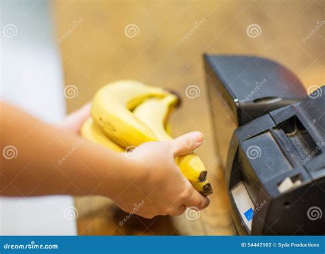 Close Up Of Hands Buying Bananas At Checkout Stock Photo Image Of