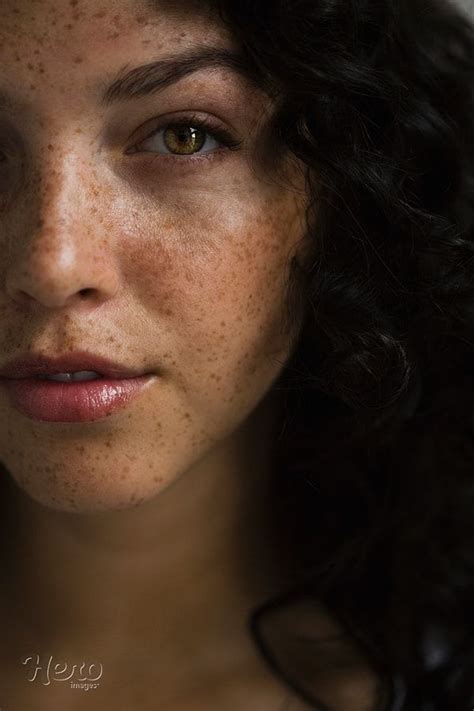 Close Up Portrait Of Serious Woman With Freckles By Hero Images Photo