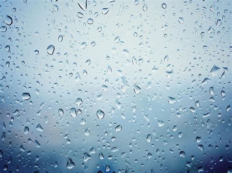 Rain In City Water Drops On Wet Window Glass Blured Background Ad