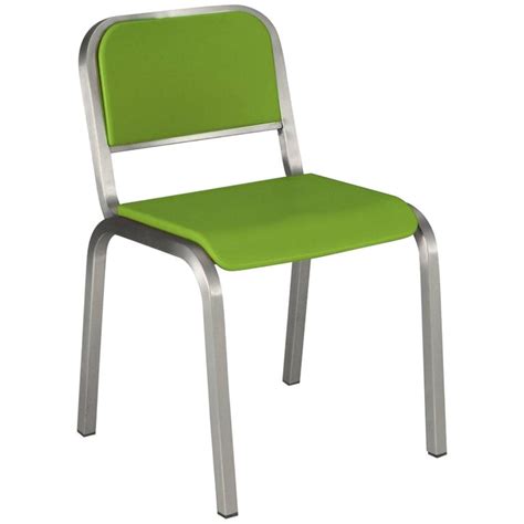 This chair has a classic dining room chair look navy style modernized by its brushed aluminum finish and rounded style. Emeco Nine-0 Chair in Brushed Aluminum and Green by Ettore ...