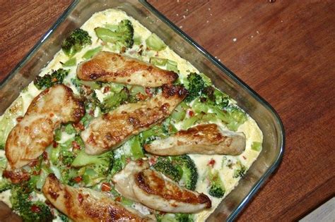 Chicken And Broccoli Casserole In A Glass Dish On A Wooden Table