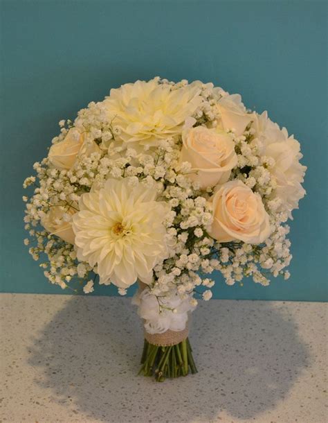 Pretty Ivory Bridal Bouquet Featuring Roses Dahlia And Gypsophila