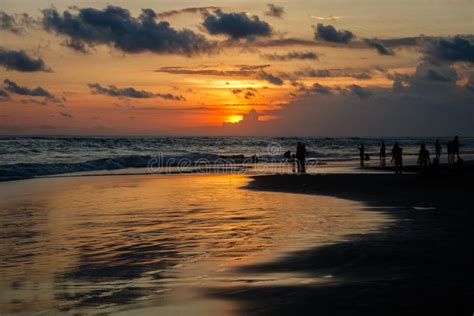 Berawa Beach Pantai Berawa At Sunset Silhouettes Of Two People Sitting