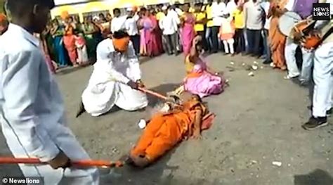 blindfolded axeman cracks open coconuts held by three women in india best world news