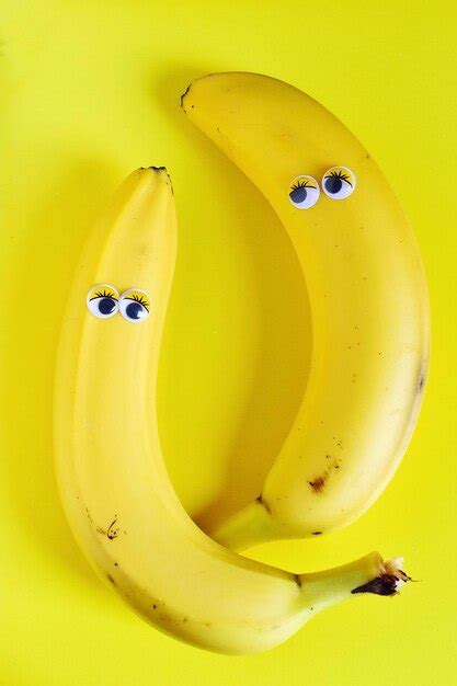 Premium Photo Googly Eyes On Bananas Over Yellow Background