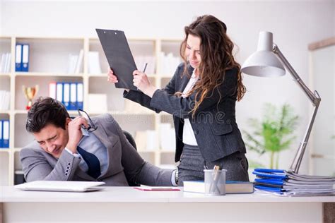 The Sexual Harassment Concept With Man And Woman In Office Stock Image