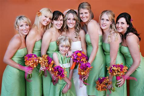 Bride Bridesmaids And Flower Girl Posing For Group Portrait
