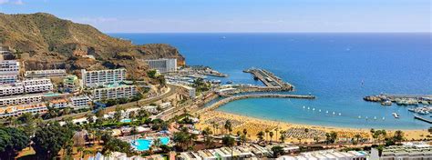 The very name puerto rico gran canaria conjures up images of endless sunshine, lively entertainment and beautiful sandy beaches on an exotic island location. Playa de Puerto Rico, Gran Canaria