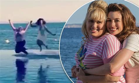 Anne Hathaway And Rebel Wilson Leap Into A Pool Fully Clothed On The