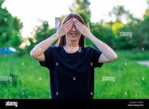 The Brunette Girl With Her Hands Closed Her Eyes Braces Smile Happily