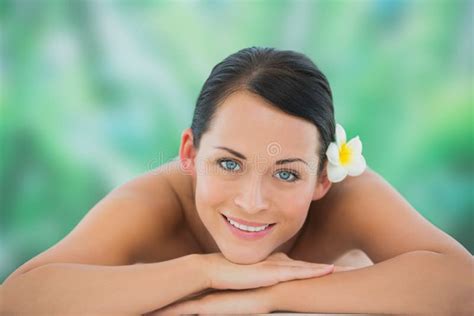 Beautiful Brunette Relaxing On Massage Table Smiling At Camera Stock Image Image Of Head