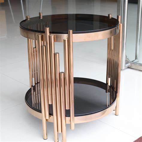 This shiny nesting table set is out to tell the world that stainless steel isn't just for the kitchen! China New Design Glass Coffee Table with Metal Frame ...