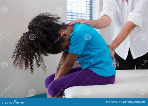 Physiotherapist Giving Back Massage To Girl Patient In Clinic Stock Image Image Of Massage