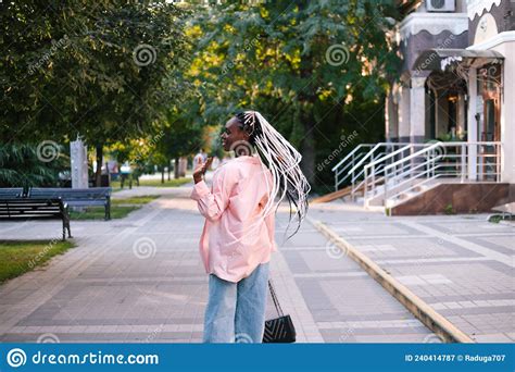 Beautiful Black Woman With Braided Hair Posing At Street Stock Image