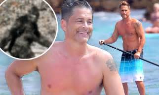 rob lowe reveals toned and tanned physique in swim trunks daily mail online