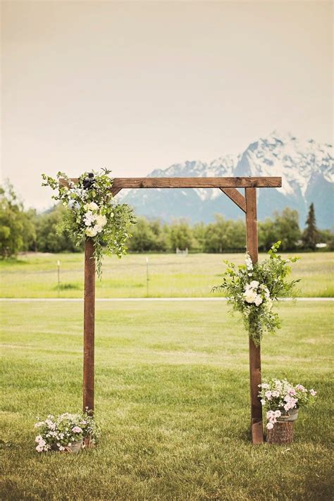 Jordan And Wrangels Wedding In Palmer Alaska Wedding Arch Greenery