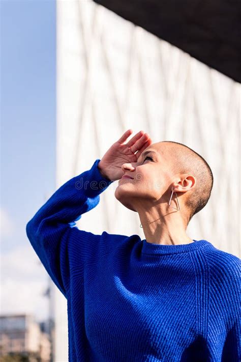 Woman With A Shaved Head Smiling Looking At Camera Stock Image Image